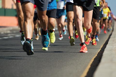 A group of people running on a road
Description automatically generated with medium confidence