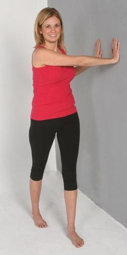 E:Exercise Library Pics - StretchesWall Rotation StretchWall Rotation Stretch (#1).JPG